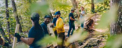 working on a trail in the woods