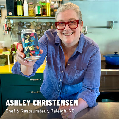 Ashley Christensen holding a can of Aftershift Non-Alcoholic brew